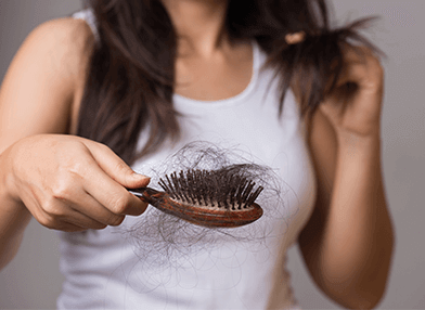 As causas da queda de cabelo